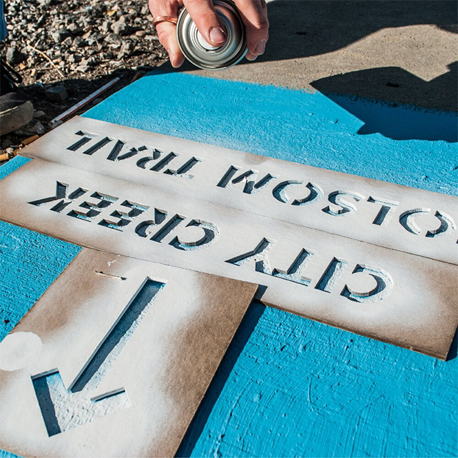 A stencil for spray-painting temporary signage
