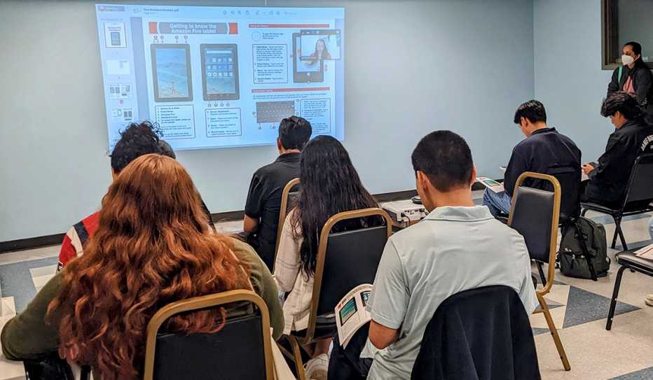 Students attend a training to teach digital literacy skills to older adults