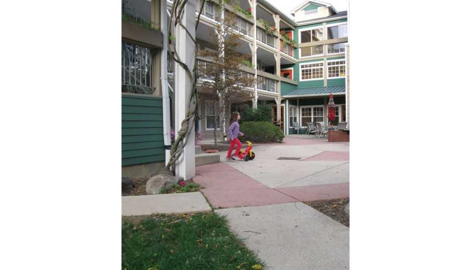 Girl Plays In Courtyard, Residences, Co-Housing, Livable Communities