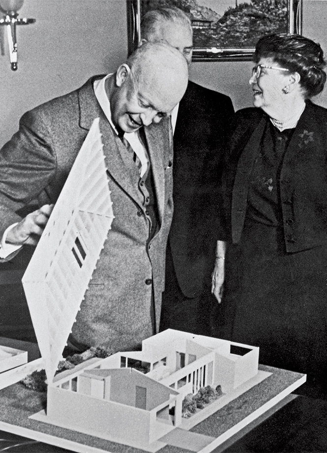 President Dwight D. Eisenhower looks at a tabletop model of The Freedom House during a visit with AARP founder Ethel Percy Andrus