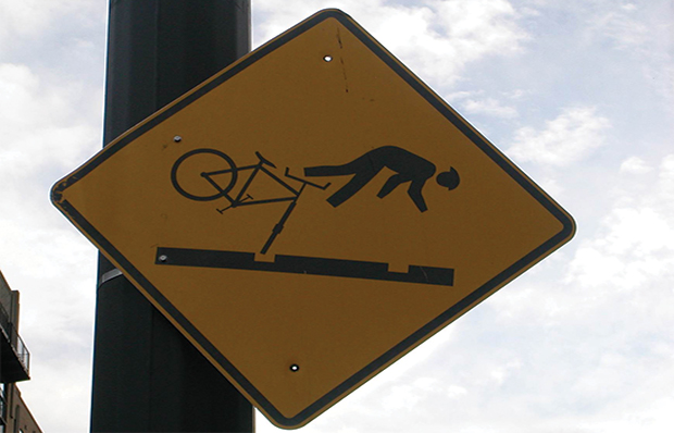 A hazard sign warning bicyclists in Portland, Oregon, of streetcar tracks in a roadway