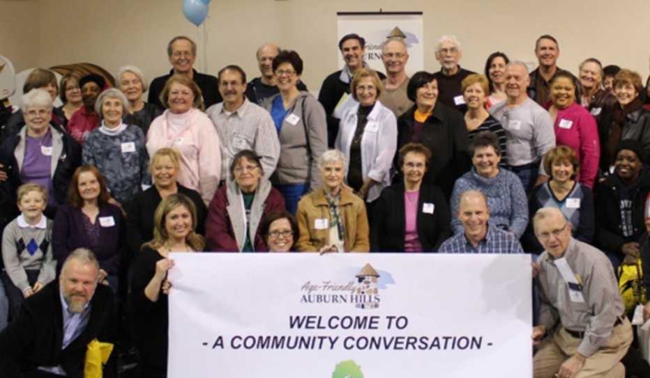 Attendees of an Age-Friendly Auburn Hills event pose for a group photo