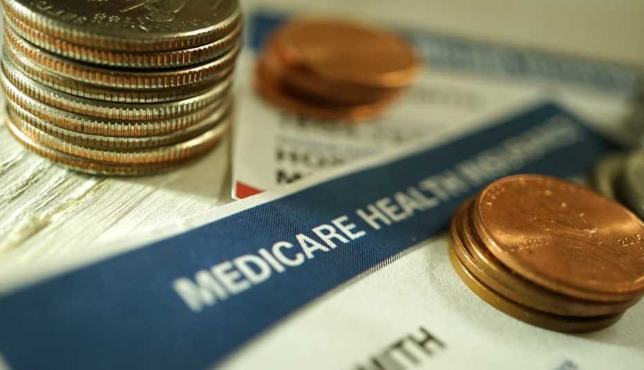 coins sitting on top of a Medicare card