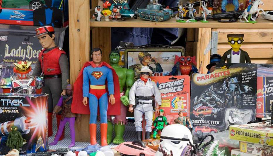 collectible toys on shelves including action figures of the lone ranger and superman