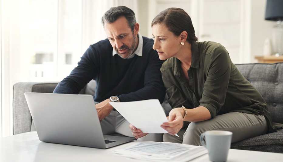 a couple looks over documents