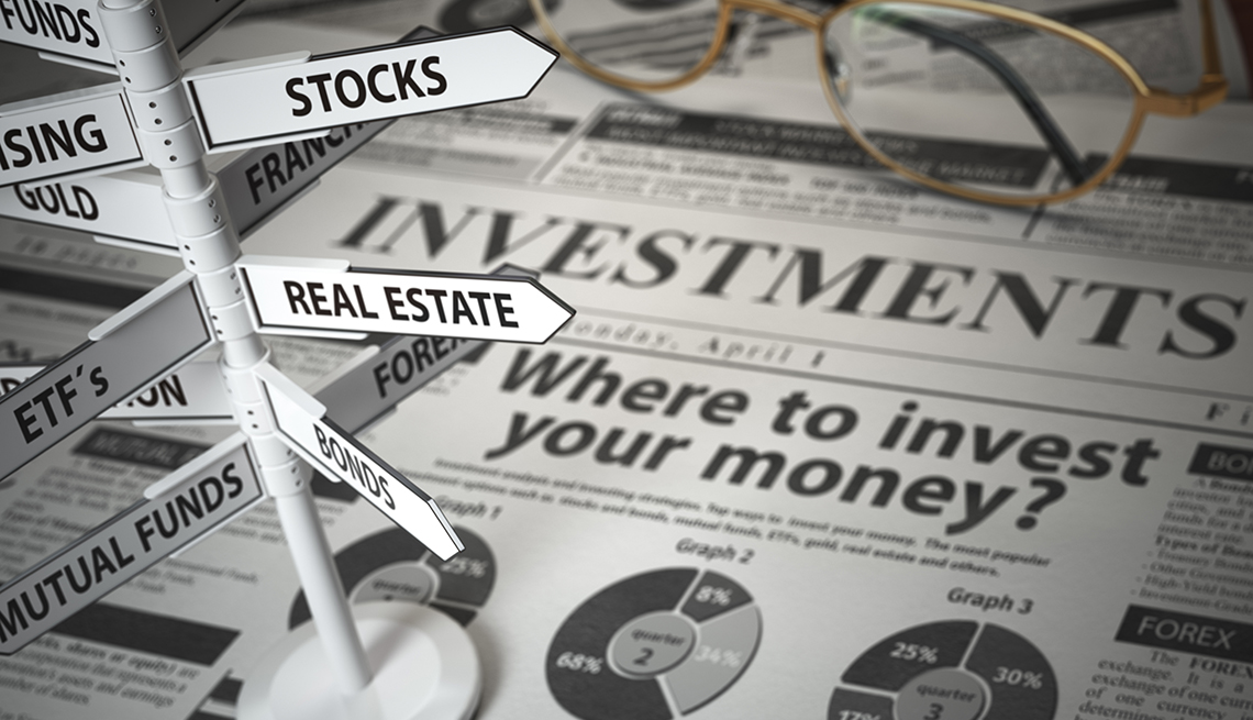newspaper and direction sign with investment options