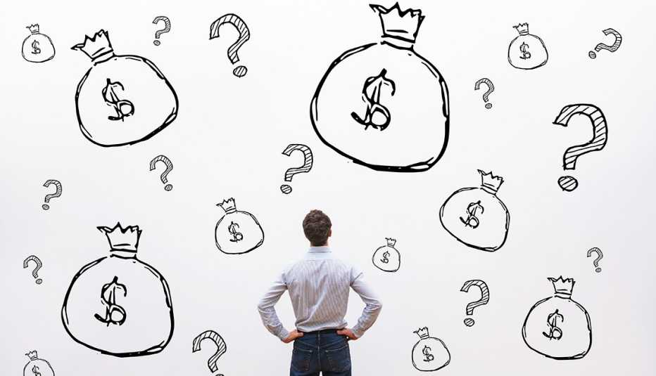 Man looking at money bags and dollar signs 