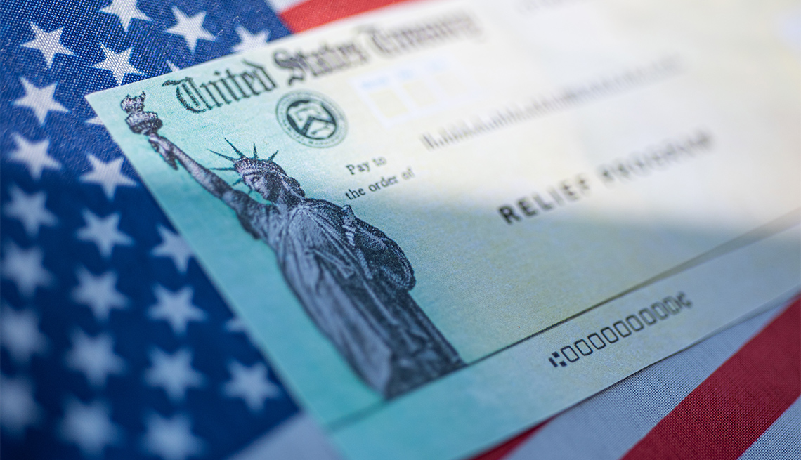 stimulus check on top of American flag