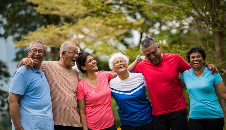 Older Asian American adults laughing in a park