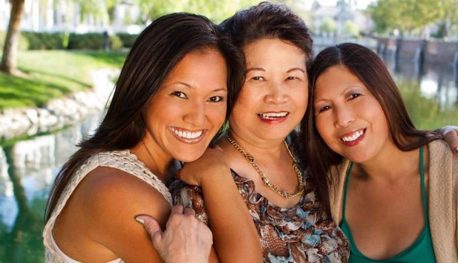 Asian mother and daughters in outdoors setting