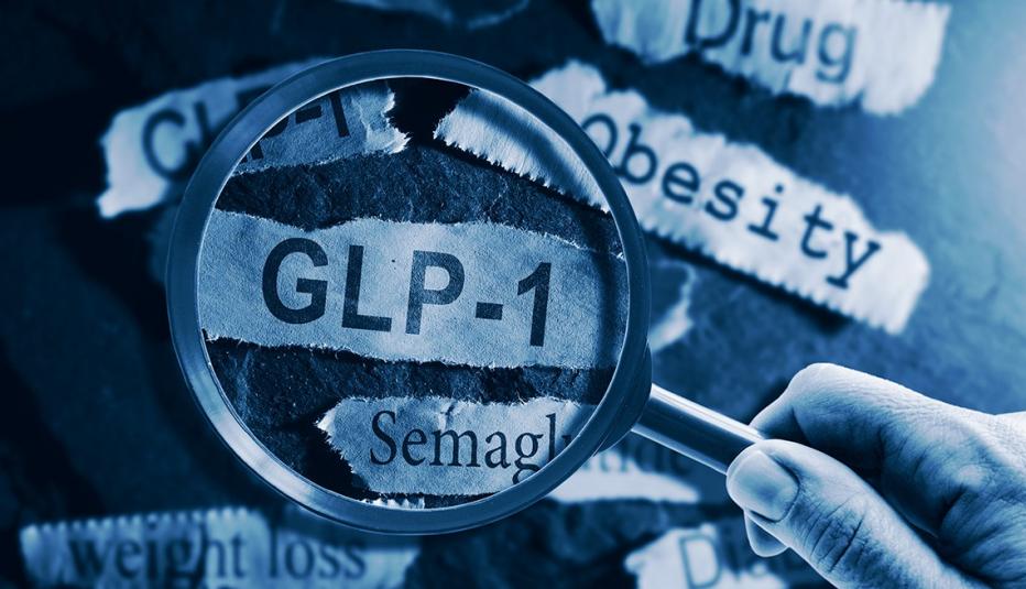 GLP-1 related drugs newspaper headlines with hand and magnifying glass