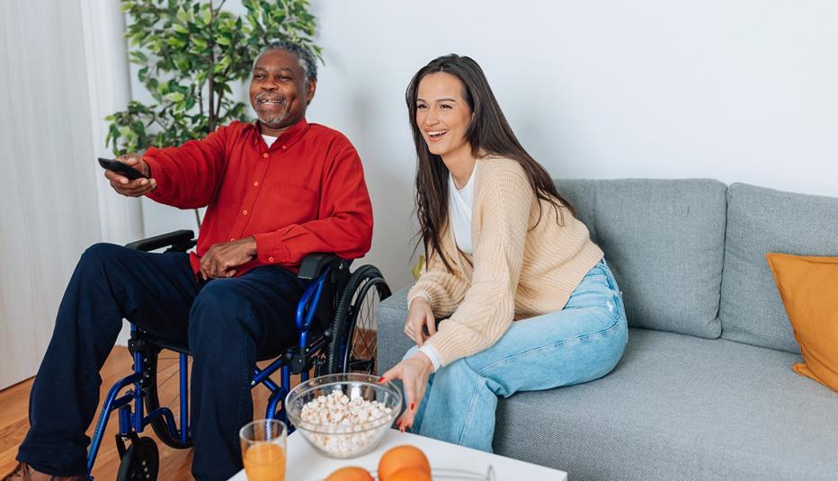 Caregiver and care receiver watching TV together