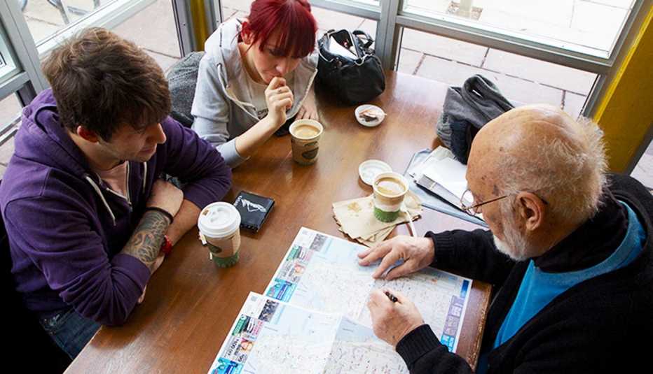 Tour Guide from Big Apple Greeter with two companions reviewing a map