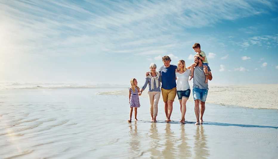 happy family going for a walk together at the beach