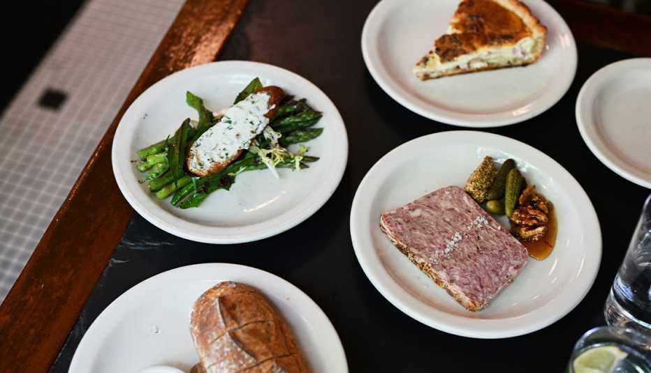 four different food items on separate plates