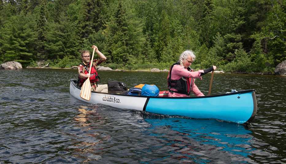 Two people paddle a canoe in Quebec