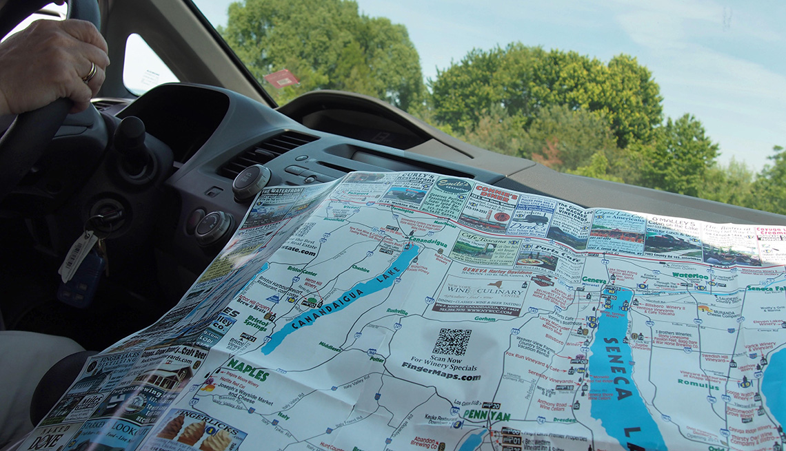 Woman using map while touring the Finger Lakes 