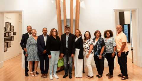 a group of people poses together for a portrait