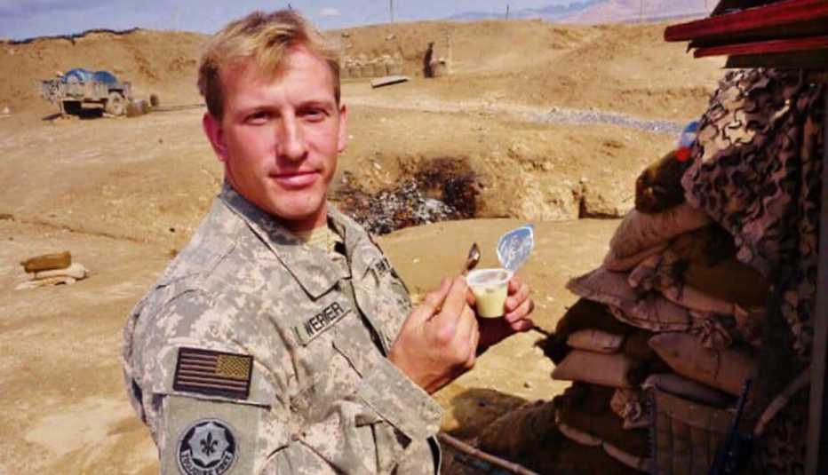 a man serving in the military in a desert