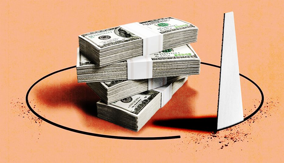 a pile of money on an orange table with a saw cutting a circle out around it
