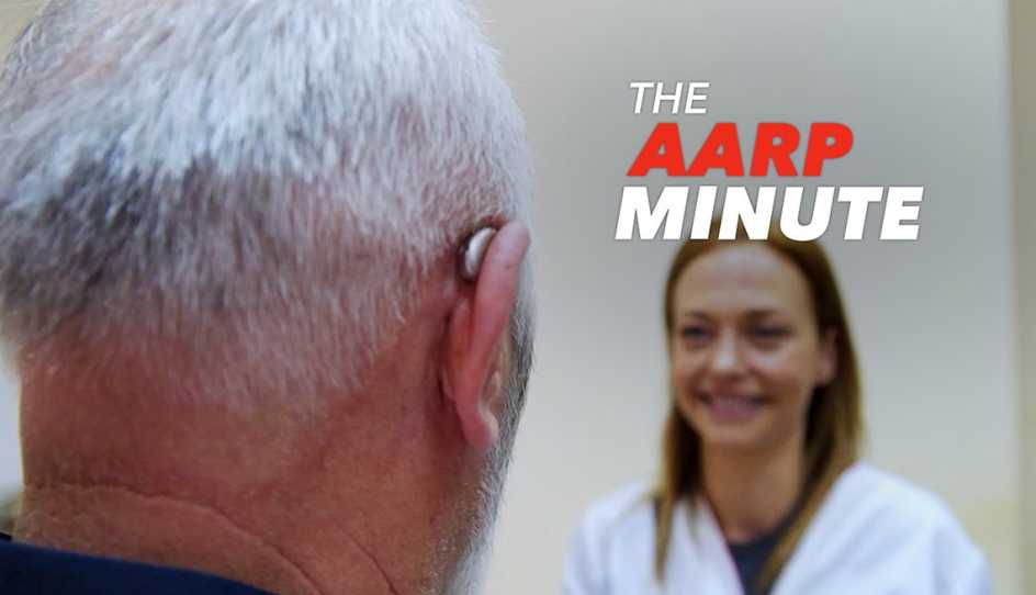a man has a hearing aid and is talking with his doctor