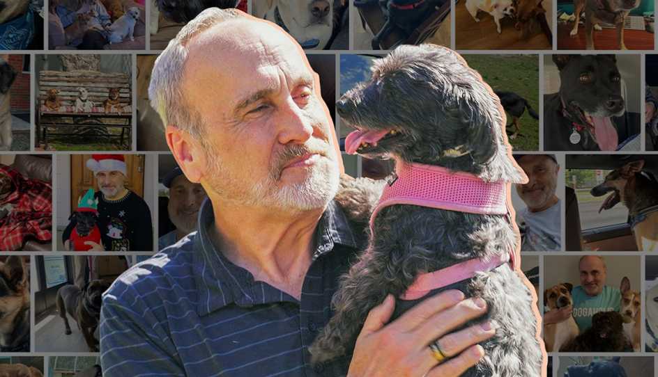 a man holding a dog