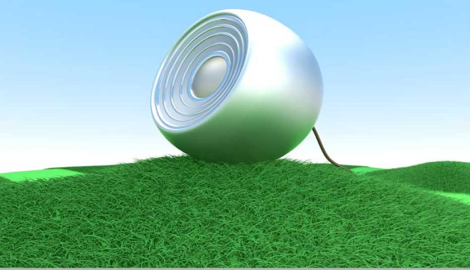 Un altavoz sobre una grama verde - 3 Consejos para elegir e instalar altavoces en su casa