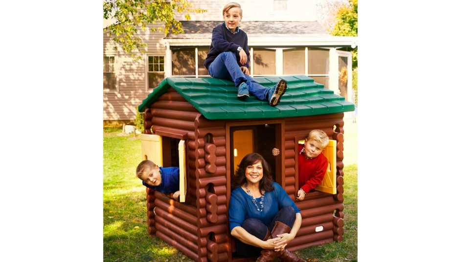 Older Mom With Her Three Kids In The Backyard, AARP Home And Family, 50 Plus Moms