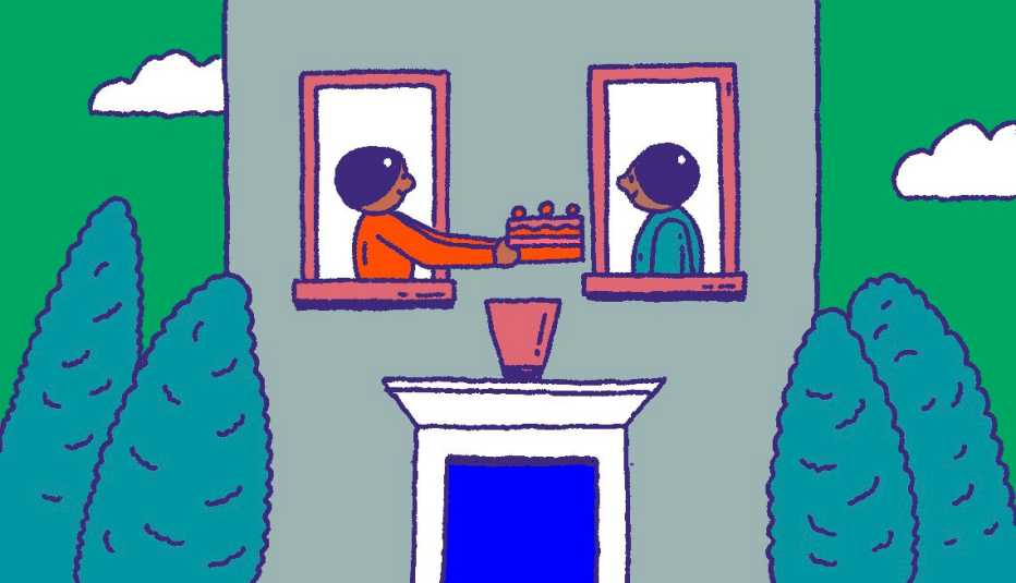 Dos personas en las ventanas de un edificio de apartamentos, una le entrega un pastel a la otra.