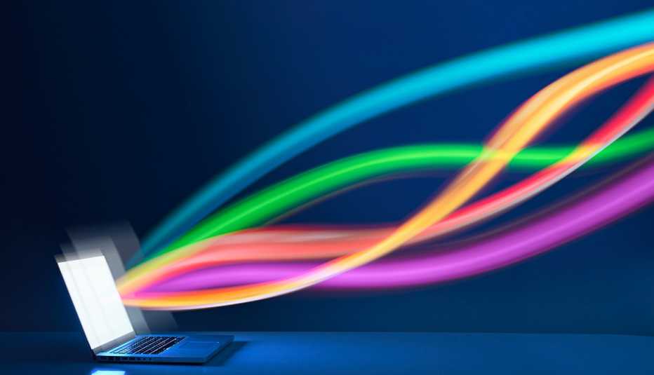 Cintas de colores que sugieren el flujo de transmisión de datos desde la pantalla de una computadora portátil