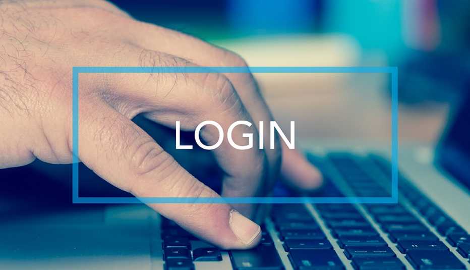 Texto dice inicio de sesión sobre una mano en un teclado de computadora