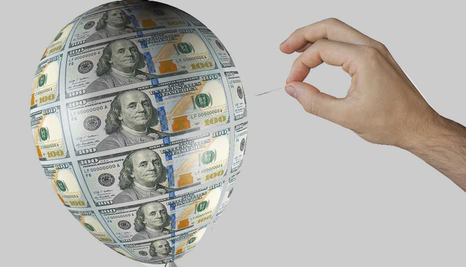 Globo ilustrado con billetes de 100 dólares y una mano que lo romperá con un alfiler