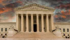 Rain clouds pass over the Supreme Court leaving the grounds wet and storm clouds colorful.