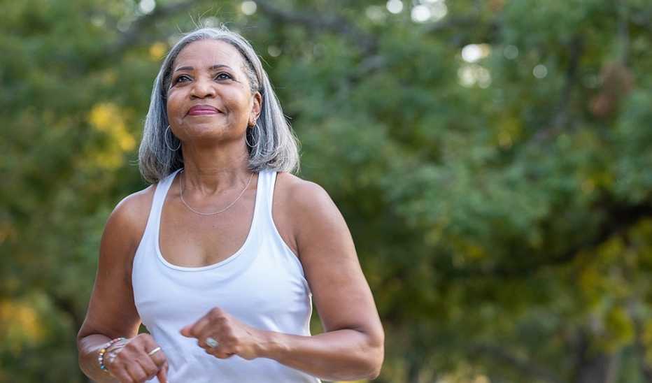 A woman jogging outside in a park
