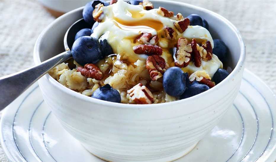 A close-up view of creamy blueberry-pecan oatmeal in a bowl