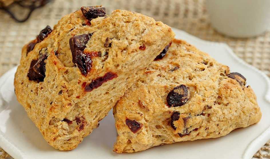 A close-up view of chocolate-cherry scones on a plate