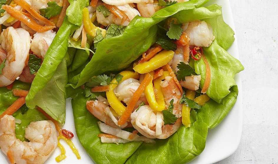 A close-up view of Vietnamese shrimp and mango lettuce wraps on a plate