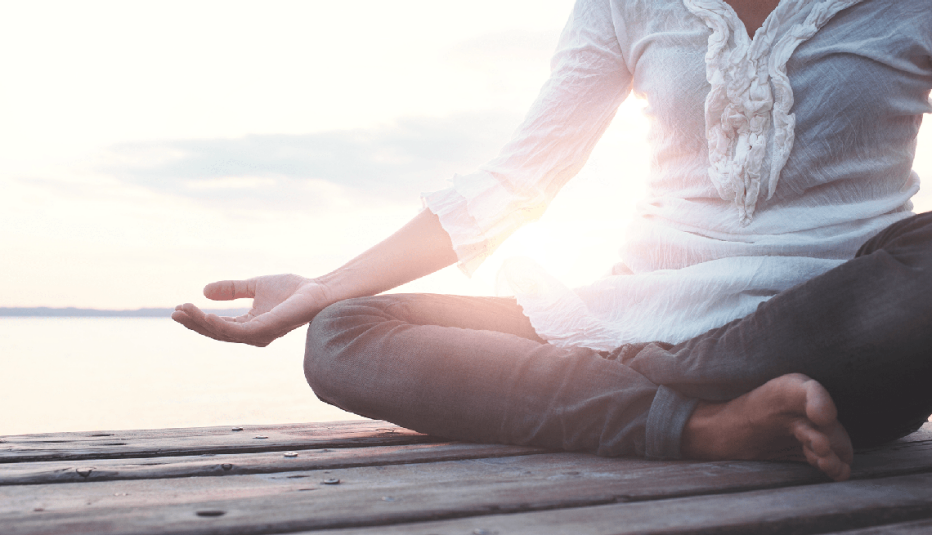 A person sitting down and meditating